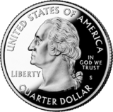 Shiny silver coin with profile of Washington bust.