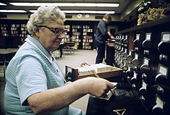 Librarian at the card files at a senior high school in New Ulm, Minnesota.jpg