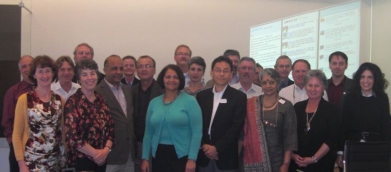 The representatives of the OERu Founding Anchor Partners at the inaugural planning meeting hosted by Otago Polytechnic, Dunedin, NZ on 09-10 November 2011.  The virtual participants are represented in the UStream, Identi.ca, Twitter streams on the display at the rear.